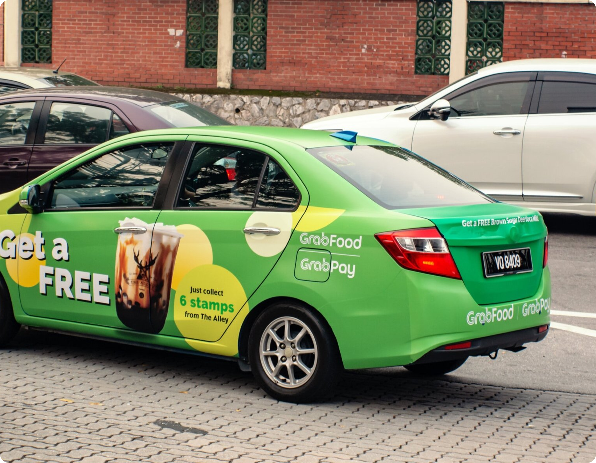 Grab e-hailing car on street